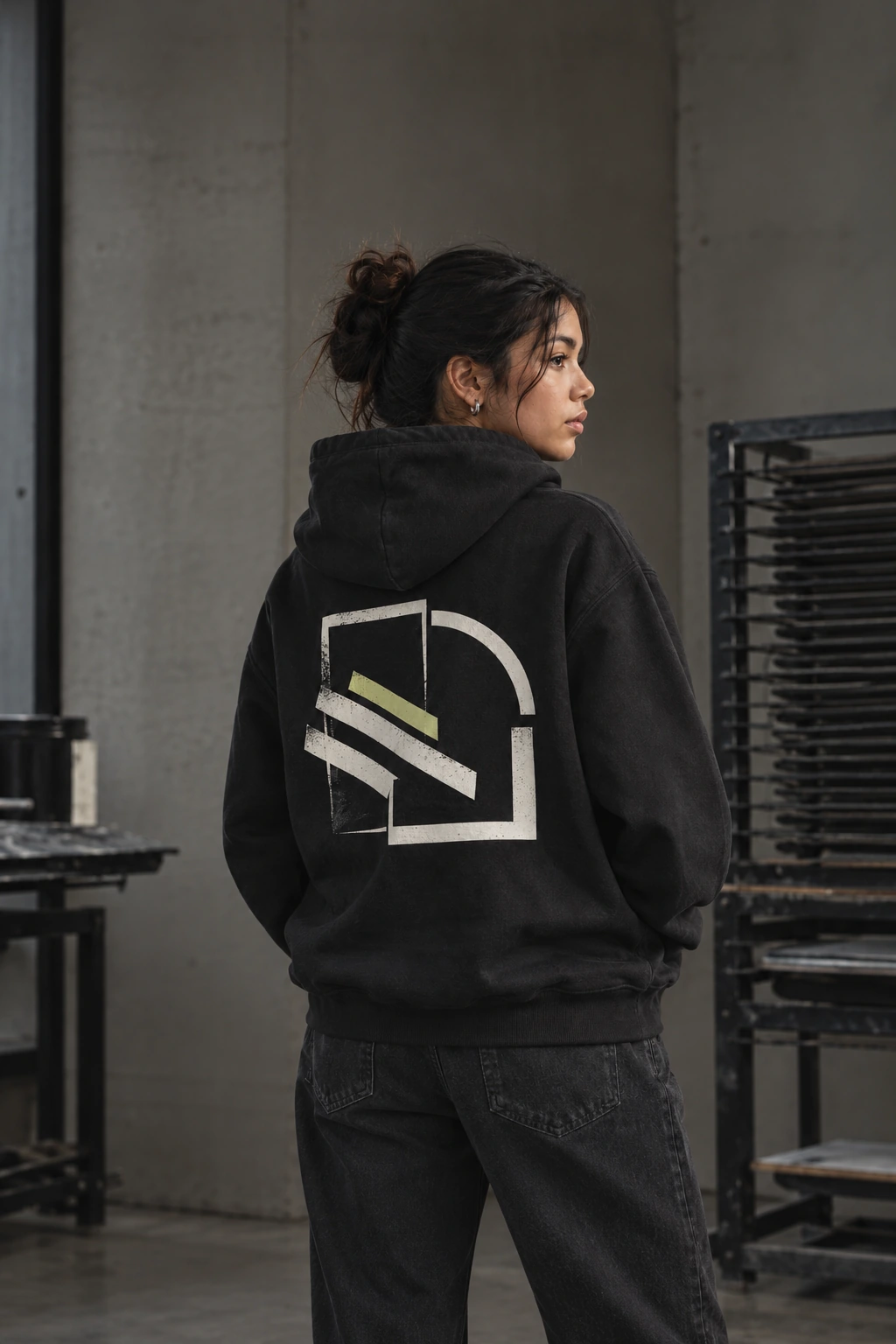 Student in a hoodie reading DIFFERENT BRIGHTER TOGETHER, shown in a green duotone.